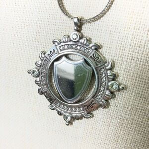 Regal Silver Crested Necklace